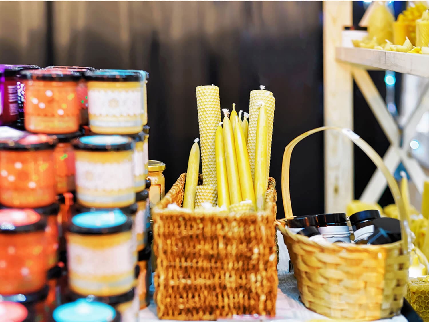 Items from an artisan market, including yellow candles