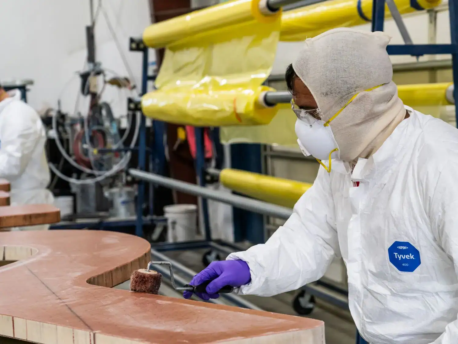 Janicki workers sanding